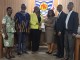 NCCE Chairperson Receives 100 Copies of 1992 Constitution from UCC to Support Civic Education