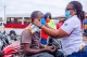 Distribution of facemasks by NCCE and Rotary Club at the Dansoman market in Accra.